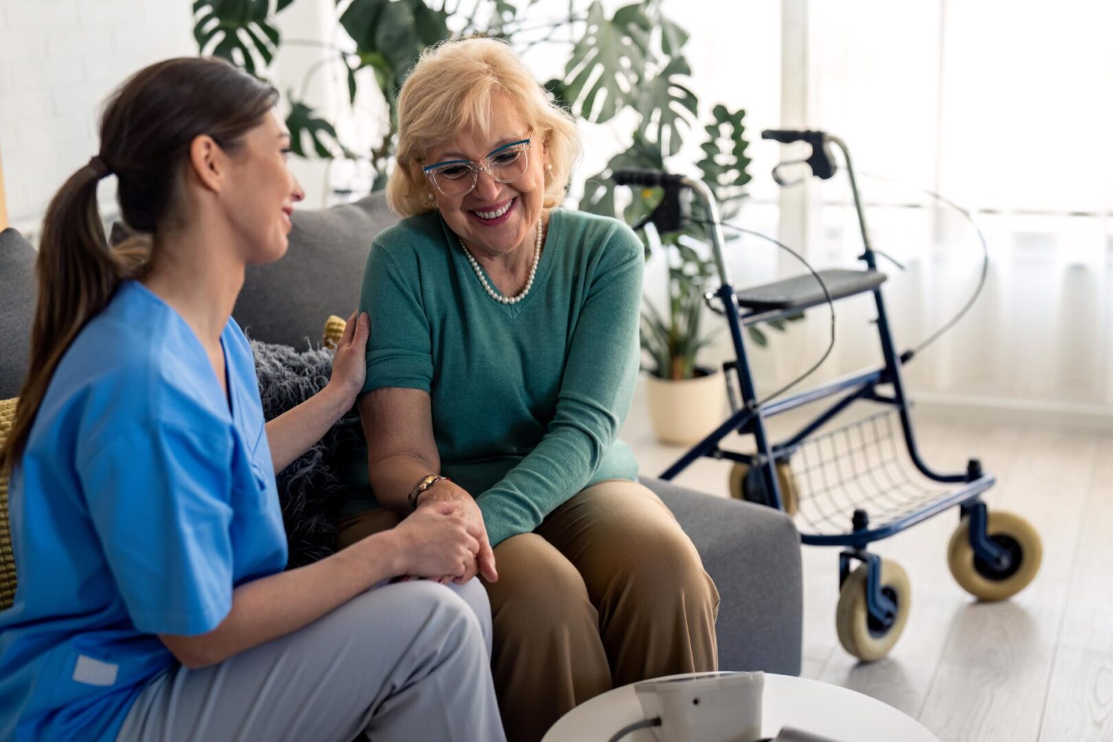 A woman sitting next to another person on a couch.